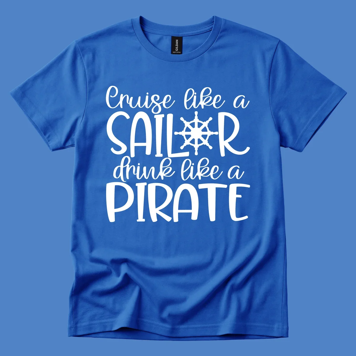White text design with ship wheel graphic reading 'Cruise like a SAILOR drink like a PIRATE' on gray background