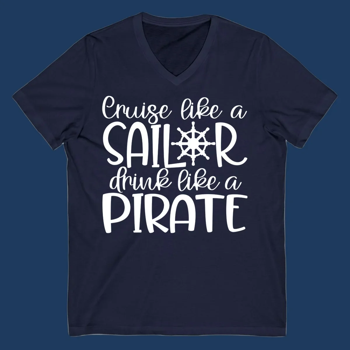 White text design with ship wheel graphic reading 'Cruise like a SAILOR drink like a PIRATE' on gray background