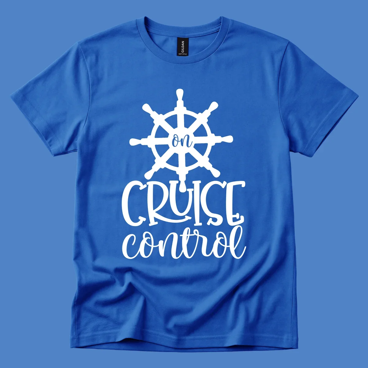 White ship wheel with 'ON CRUISE CONTROL' text below on gray background - nautical cruise design