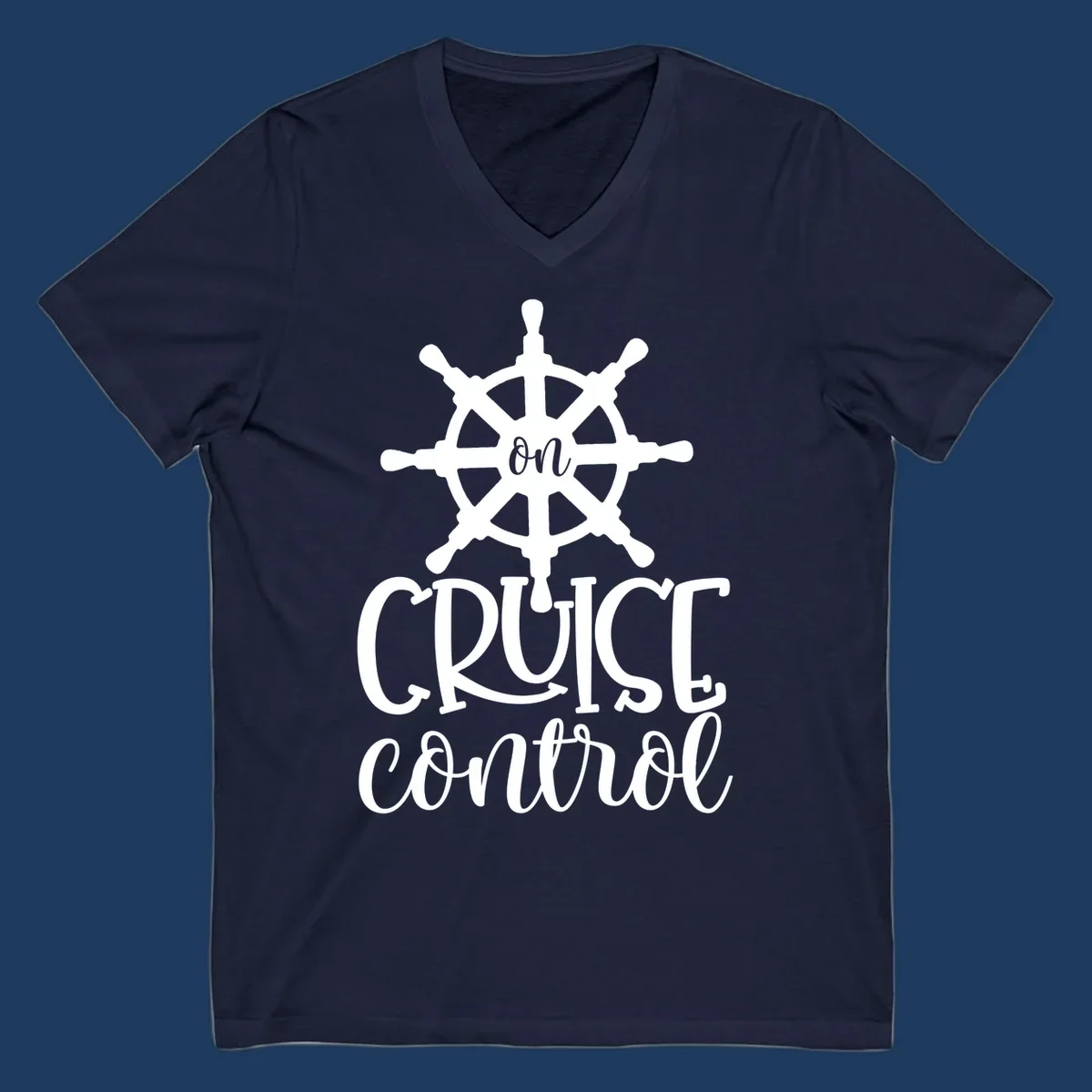 White ship wheel with 'ON CRUISE CONTROL' text below on gray background - nautical cruise design