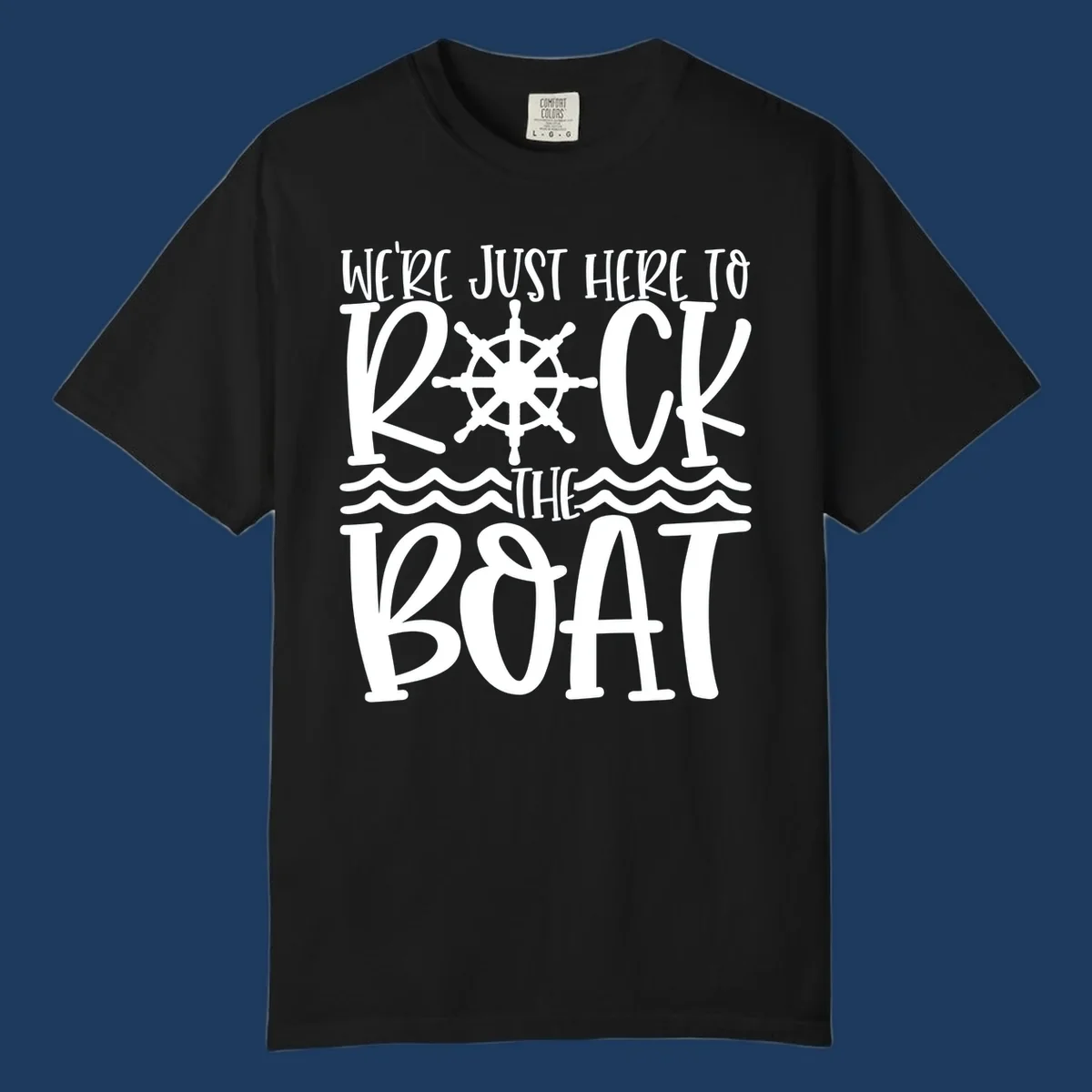 White nautical design with ship's wheel and ocean waves featuring text 'We're Just Here To Kick The Boat' on gray background