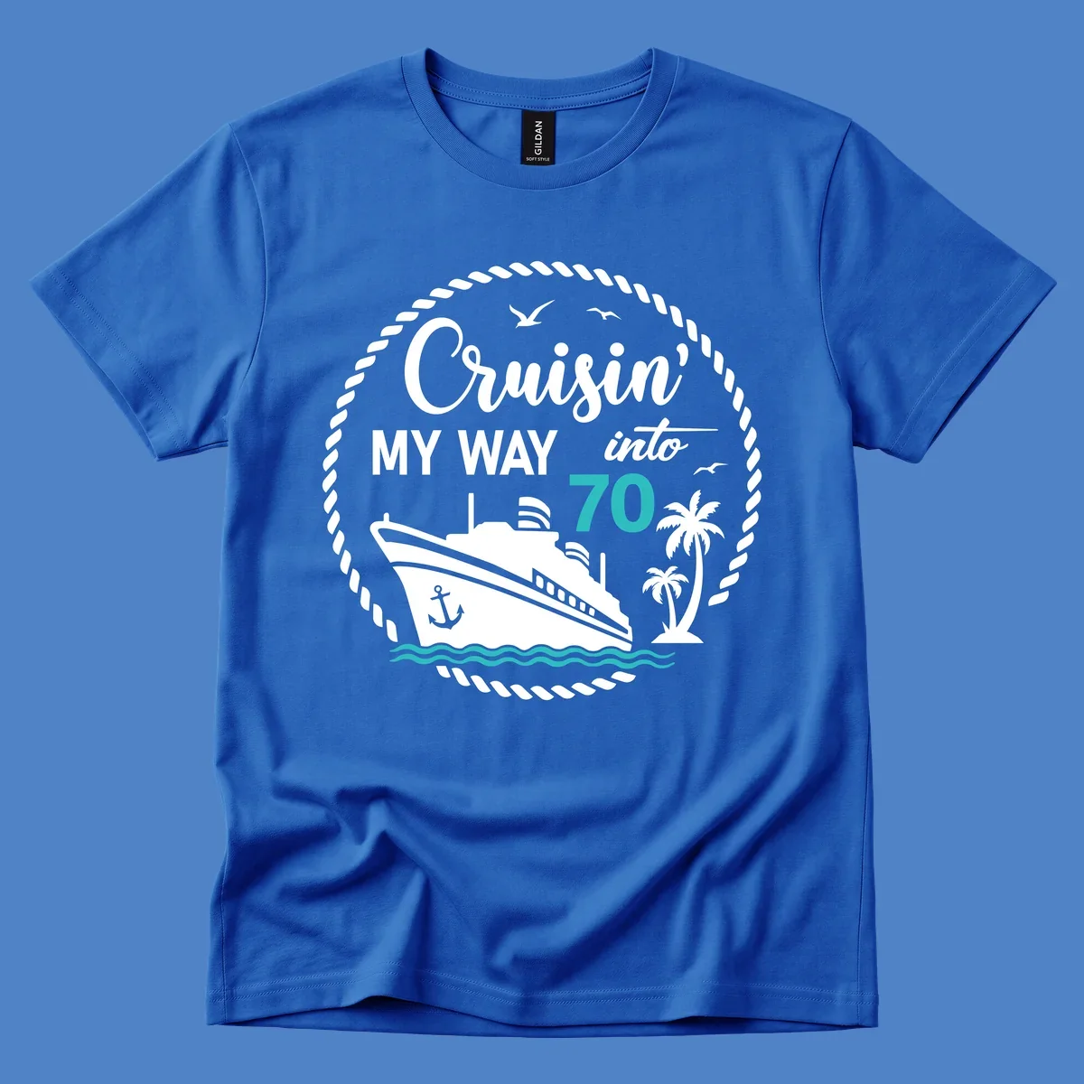 Nautical 70th birthday design with cruise ship, palm trees, and waves. Text reads 'Cruisin' MY WAY into 70' in white and teal on gray background.