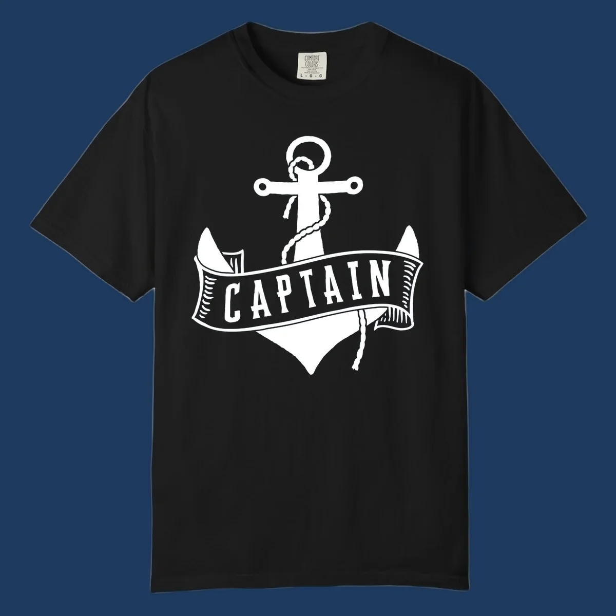 Vintage nautical captain anchor badge design with rope, cross emblem, sailing ship, and banner ribbon on gray background.