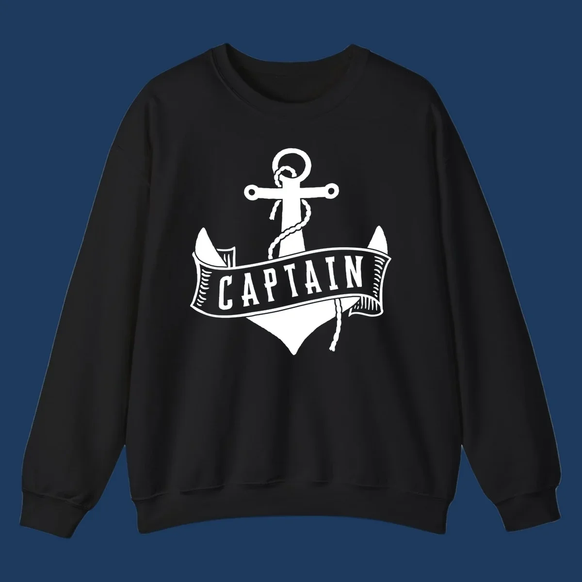 Vintage nautical captain anchor badge design with rope, cross emblem, sailing ship, and banner ribbon on gray background.