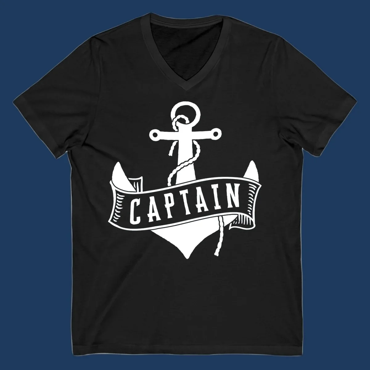 Vintage nautical captain anchor badge design with rope, cross emblem, sailing ship, and banner ribbon on gray background.
