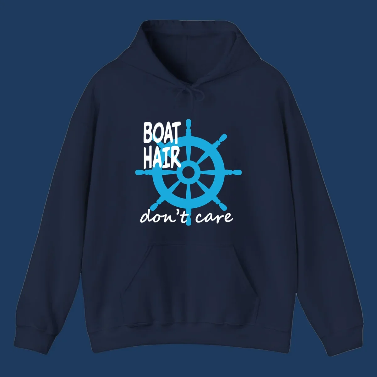 Blue ship's wheel graphic with white text reading 'BOAT HAIR don't care' - nautical cruise humor design