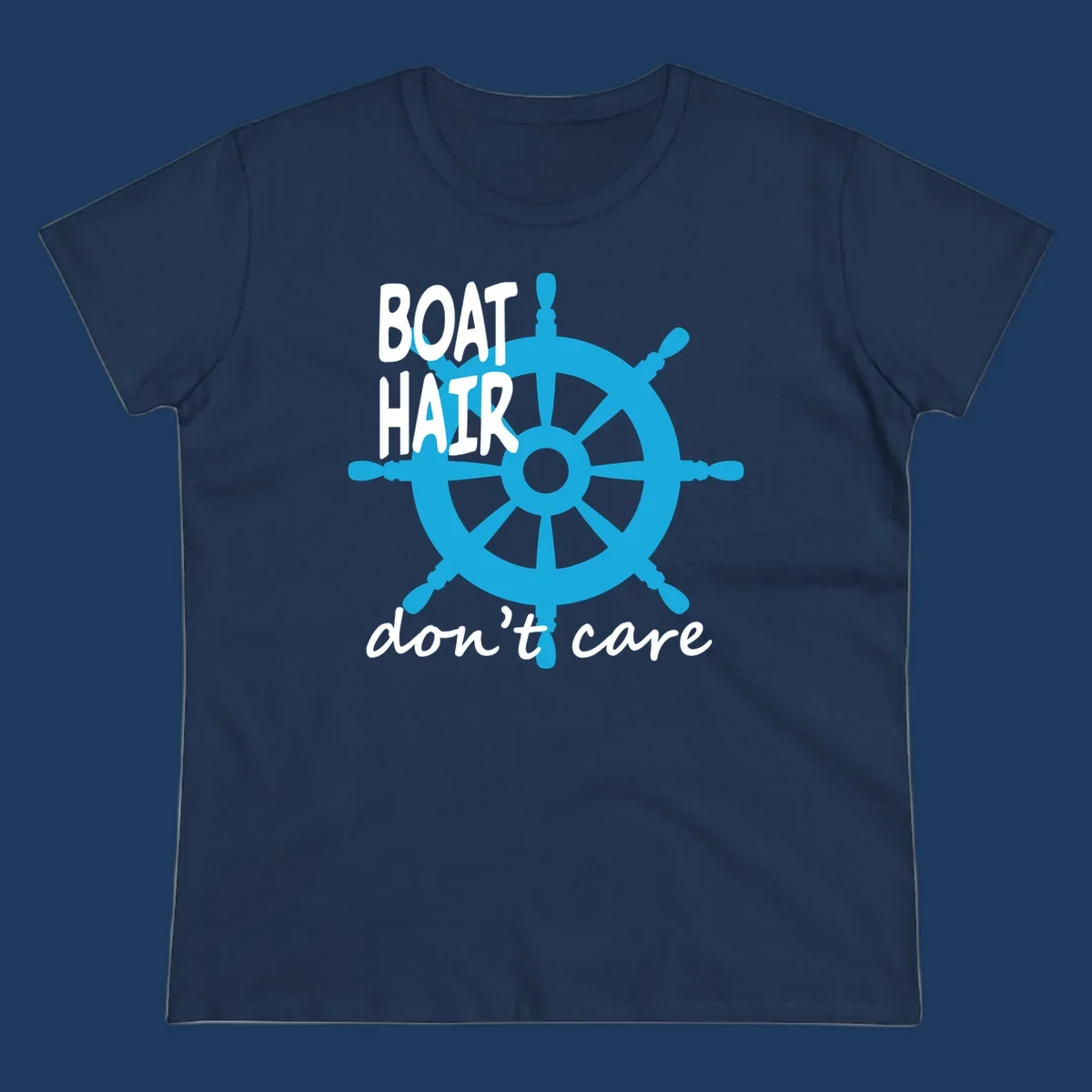 Blue ship's wheel graphic with white text reading 'BOAT HAIR don't care' - nautical cruise humor design