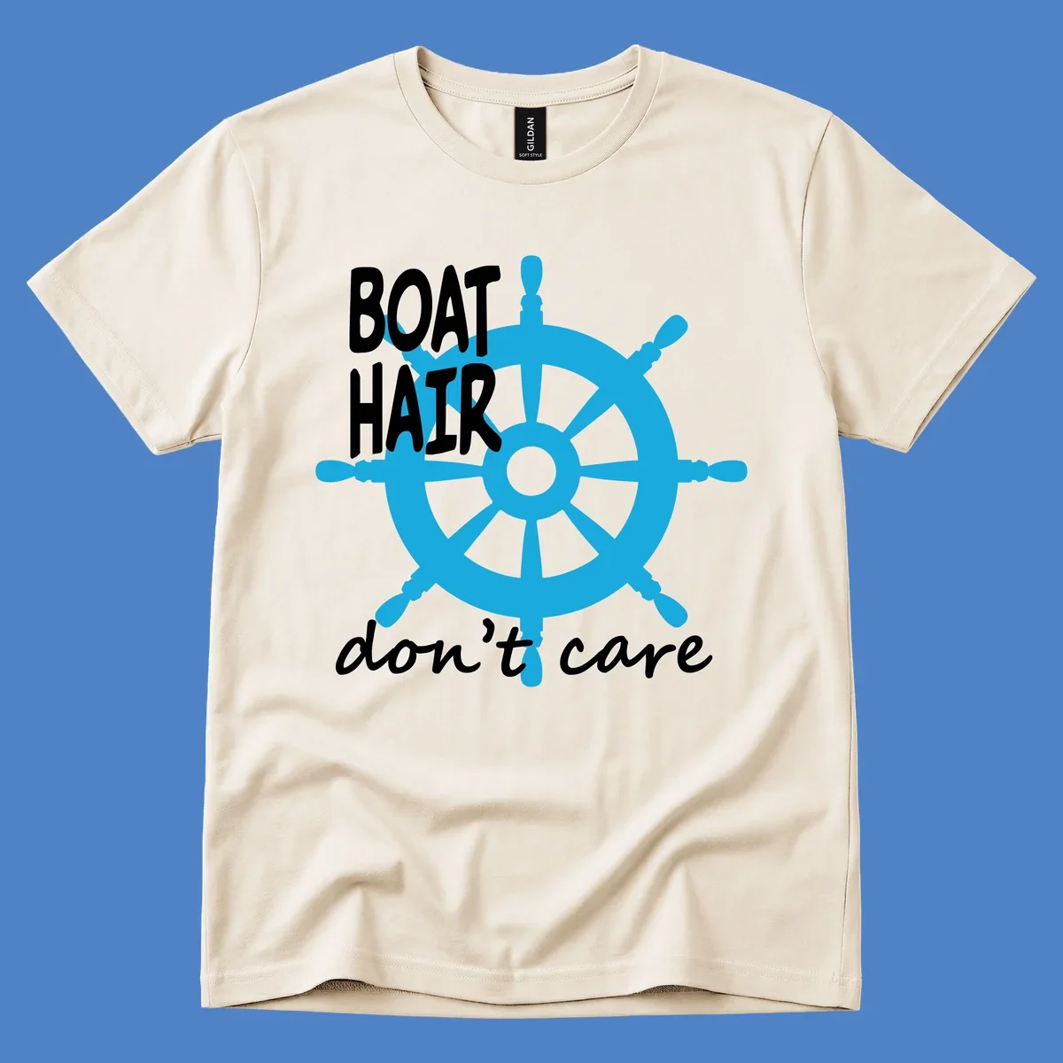 Blue ship's wheel graphic with white text reading 'BOAT HAIR don't care' - nautical cruise humor design