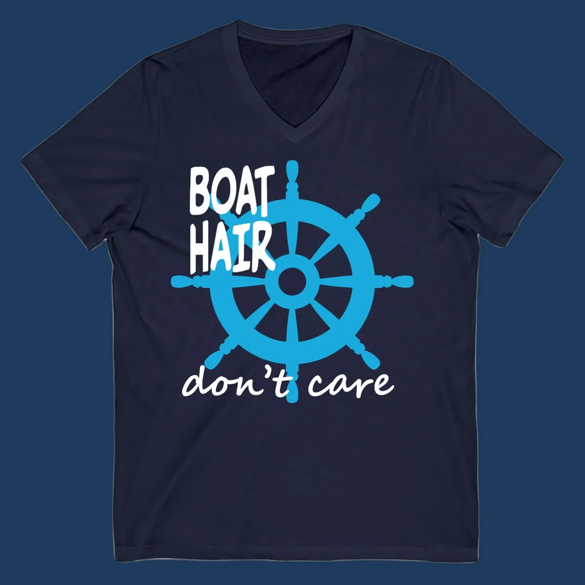 Blue ship's wheel graphic with white text reading 'BOAT HAIR don't care' - nautical cruise humor design