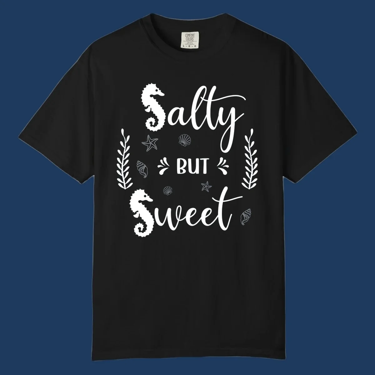 Salty but sweet nautical design with seahorses, starfish, and seashells in white on gray background