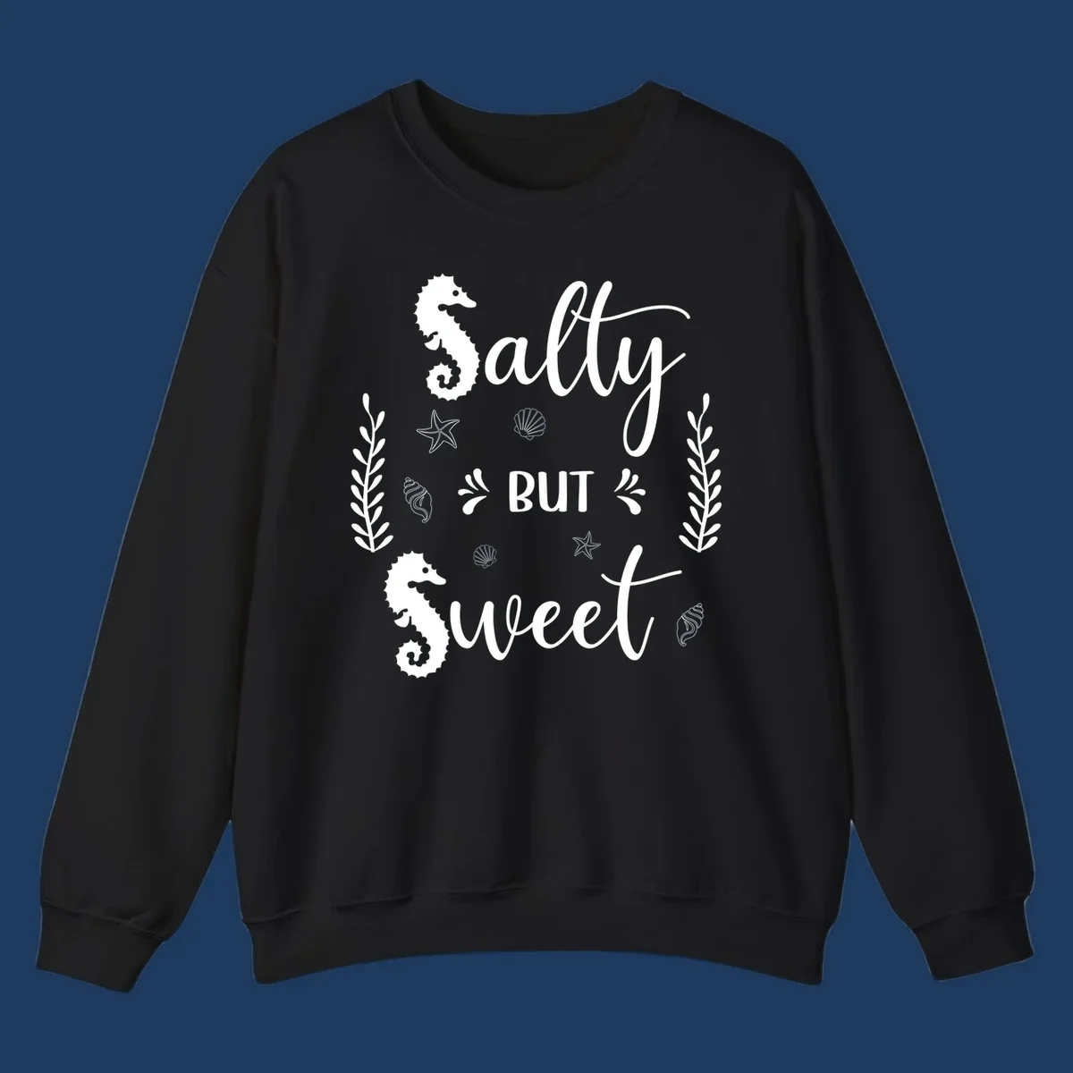 Salty but sweet nautical design with seahorses, starfish, and seashells in white on gray background