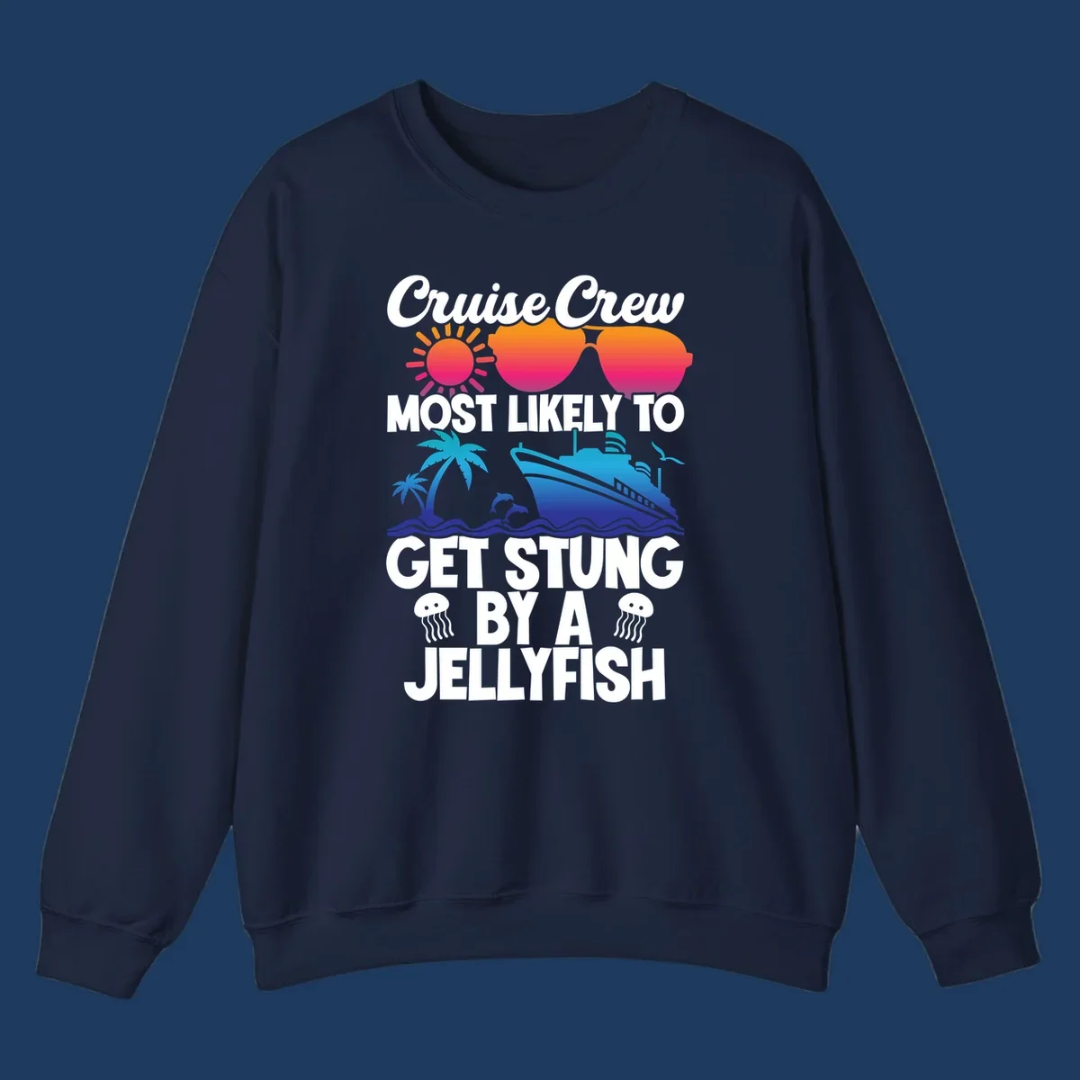 Colorful cruise design with sun, ship, dolphins, and jellyfish. Text reads 'Cruise Crew Most Likely To Get Stung By A Jellyfish'