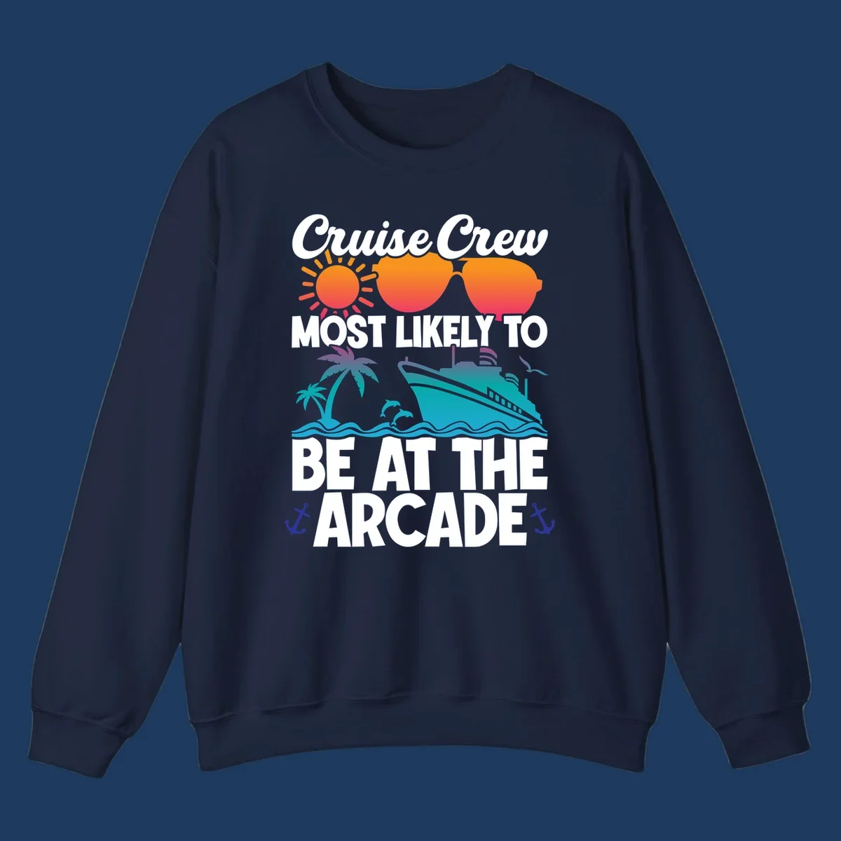 Colorful cruise-themed design with sun, sunglasses, palm tree, ship and waves. Text reads 'Cruise Crew Most Likely To Be At The Arcade' in white letters with gradient orange to teal colors and anchor accents.