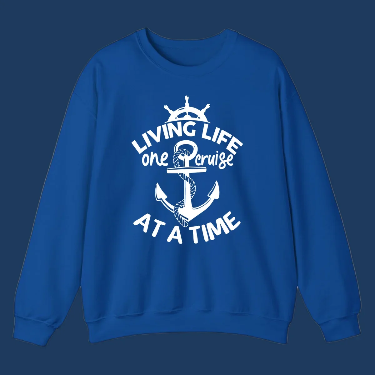 White nautical design with ship's wheel, anchor and rope on gray background with text living life one cruise at a time