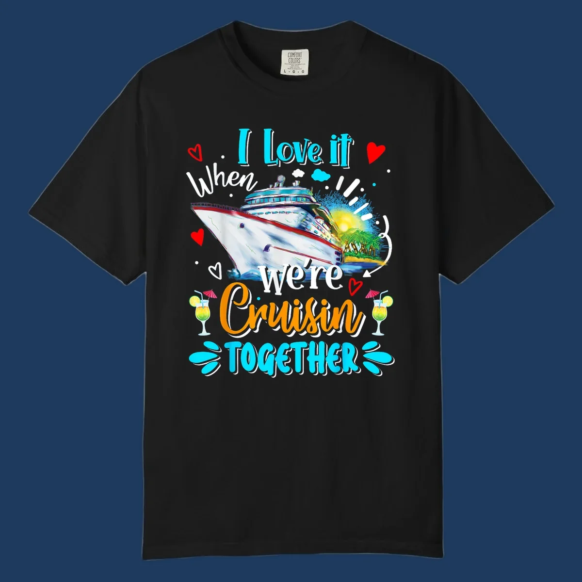 Colorful cruise ship with tropical island, hearts, and cocktails. Text reads 'I love it when we're Cruising Together' in cyan and orange lettering on gray background.