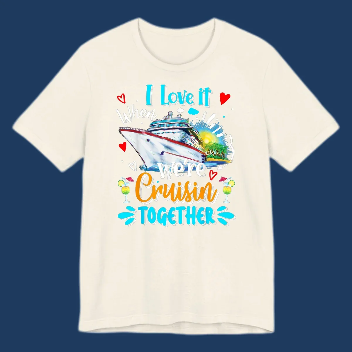 Colorful cruise ship with tropical island, hearts, and cocktails. Text reads 'I love it when we're Cruising Together' in cyan and orange lettering on gray background.