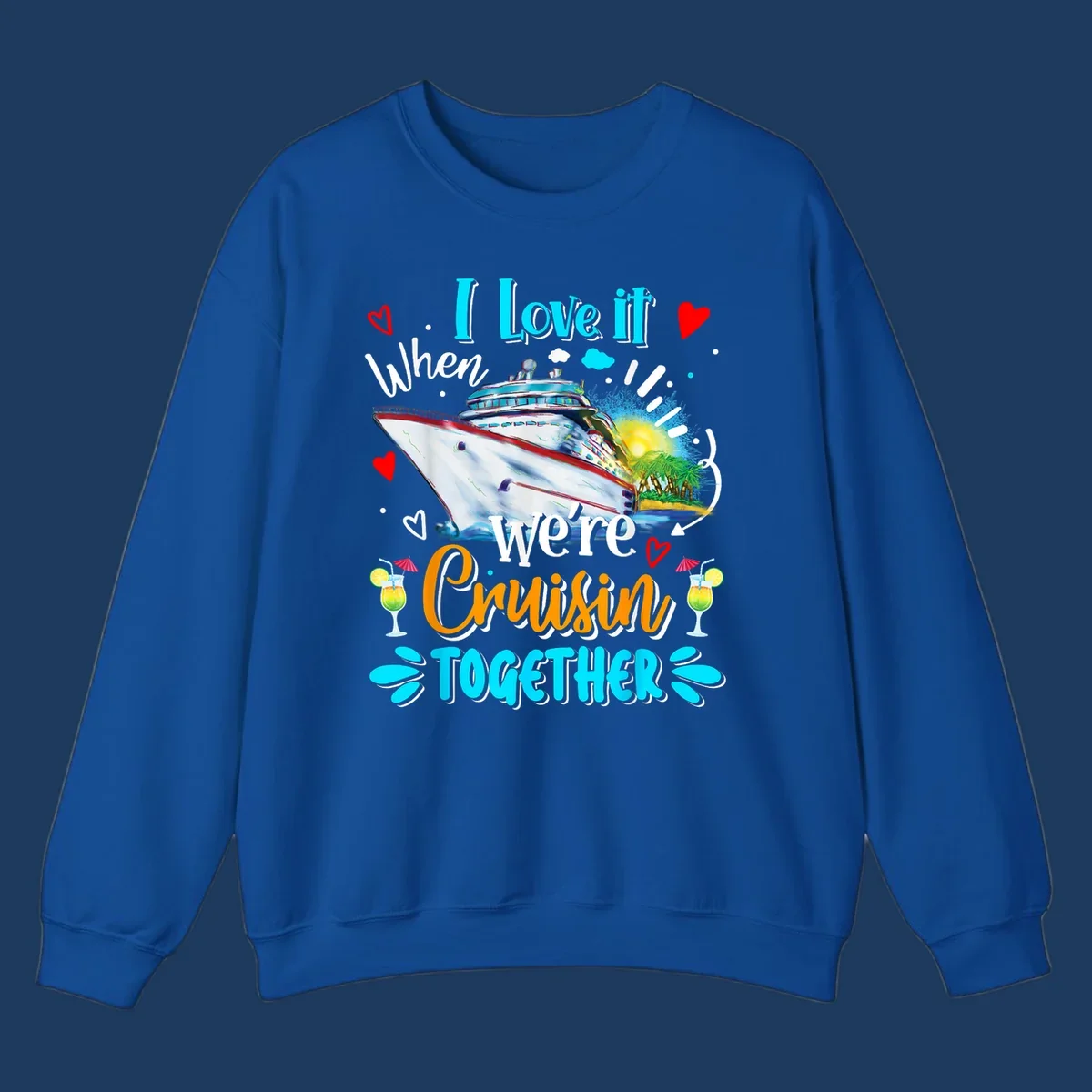 Colorful cruise ship with tropical island, hearts, and cocktails. Text reads 'I love it when we're Cruising Together' in cyan and orange lettering on gray background.