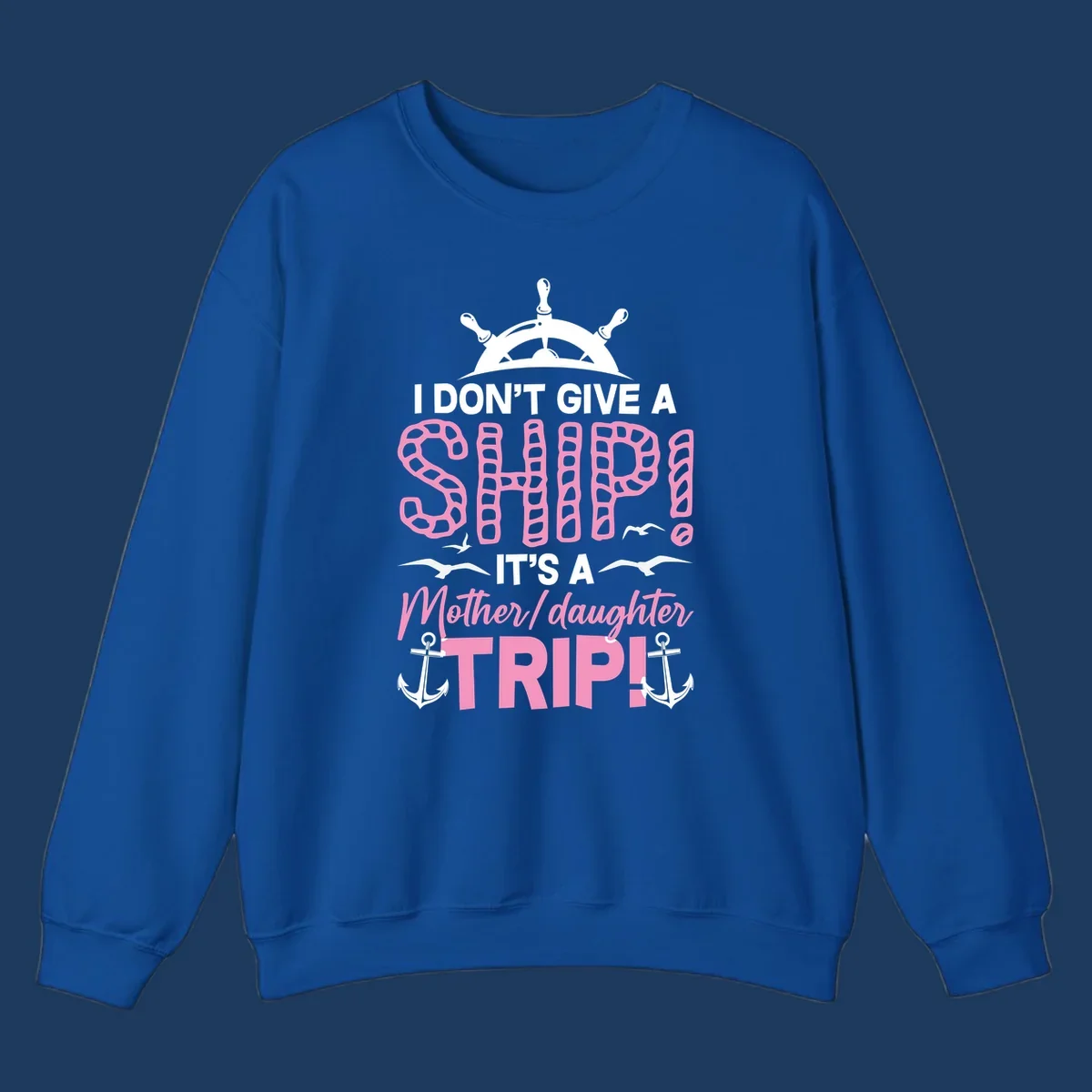 Gray design with ship wheel, anchors, and pink textured lettering reading 'I Don't Give A Ship It's A Mother Daughter Trip' - a nautical cruise humor design