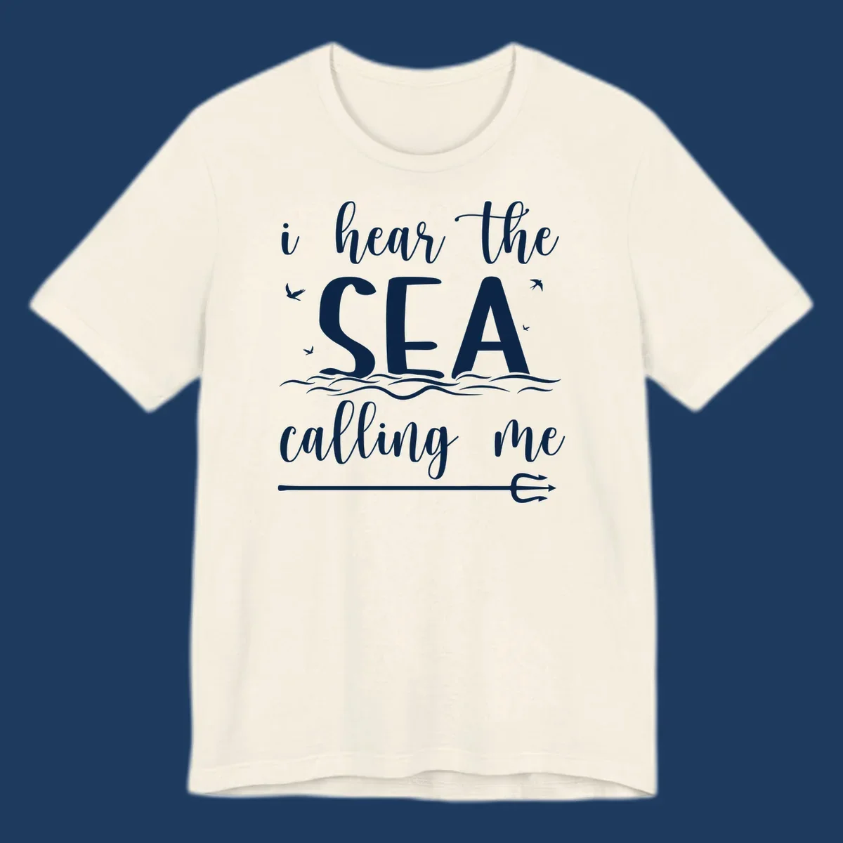 White nautical design with 'i hear the SEA calling me' text, ocean waves, seabirds, and trident anchor on gray background