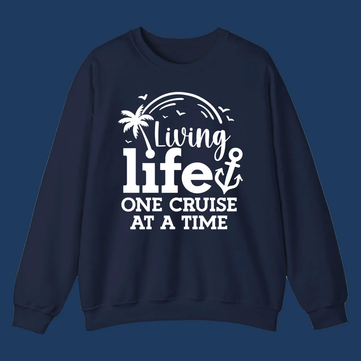 White tropical design with palm tree, anchor, rainbow and seagulls surrounding text 'Living life ONE CRUISE AT A TIME' on gray background