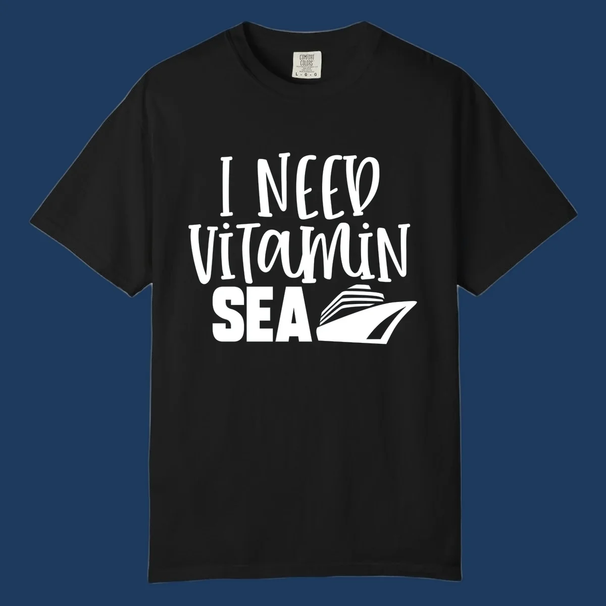 White text reading 'I Need Vitamin Sea' with a stylized cruise ship illustration on gray background