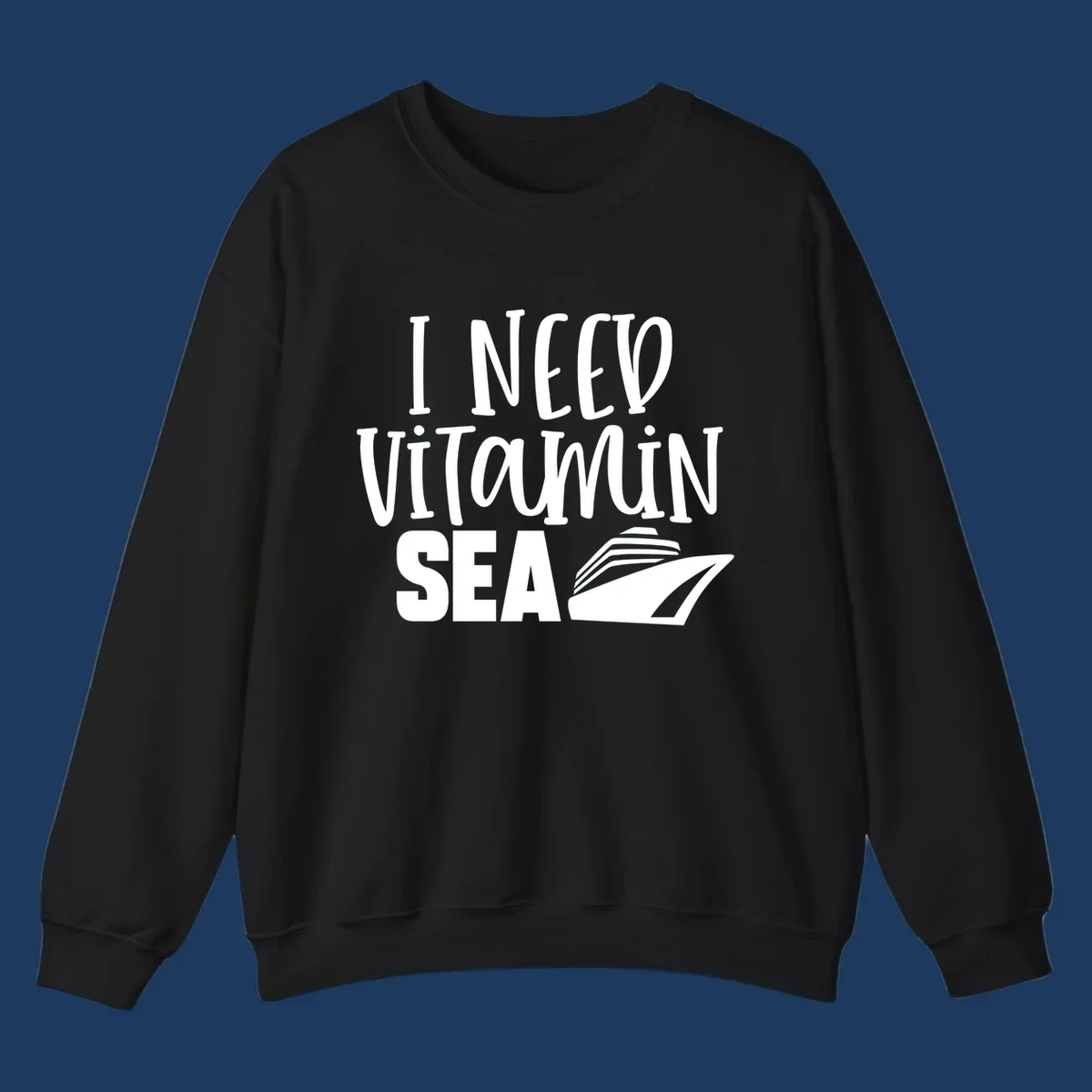 White text reading 'I Need Vitamin Sea' with a stylized cruise ship illustration on gray background