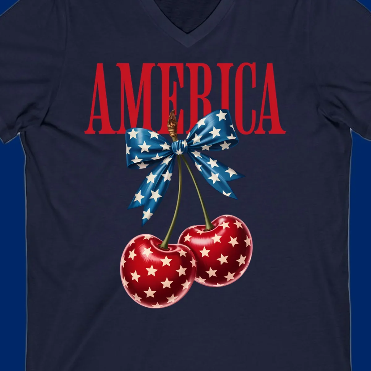 The word AMERICA in red above two red, white, and blue star-spangled cherries tied with a star bow. Features america-patriotic-cherries.