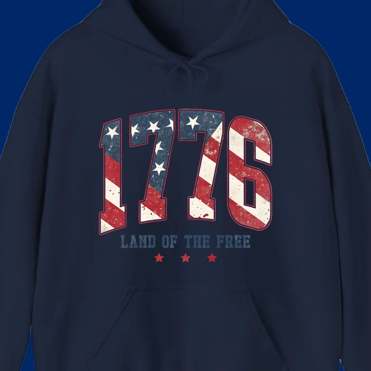 Vintage distressed design featuring the number 1776 in American flag colors and 'LAND OF THE FREE' text, celebrating America's history.