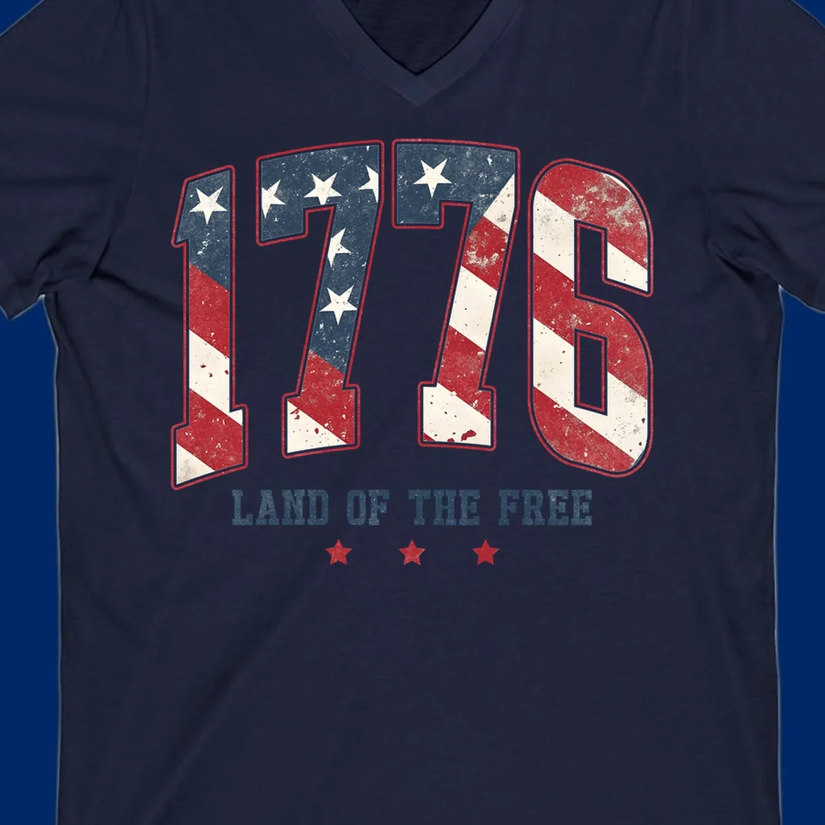 Vintage distressed design featuring the number 1776 in American flag colors and 'LAND OF THE FREE' text, celebrating America's history.