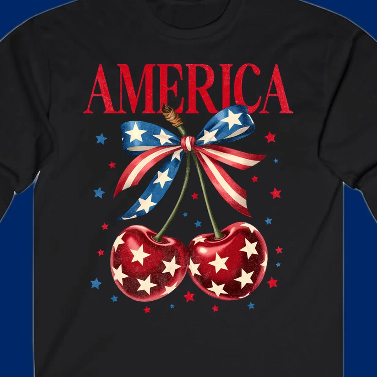 Vintage patriotic artwork featuring red 'AMERICA' text, two red cherries with white stars, and an American flag ribbon. Scattered red and blue stars complete this America-cherries-stars design.