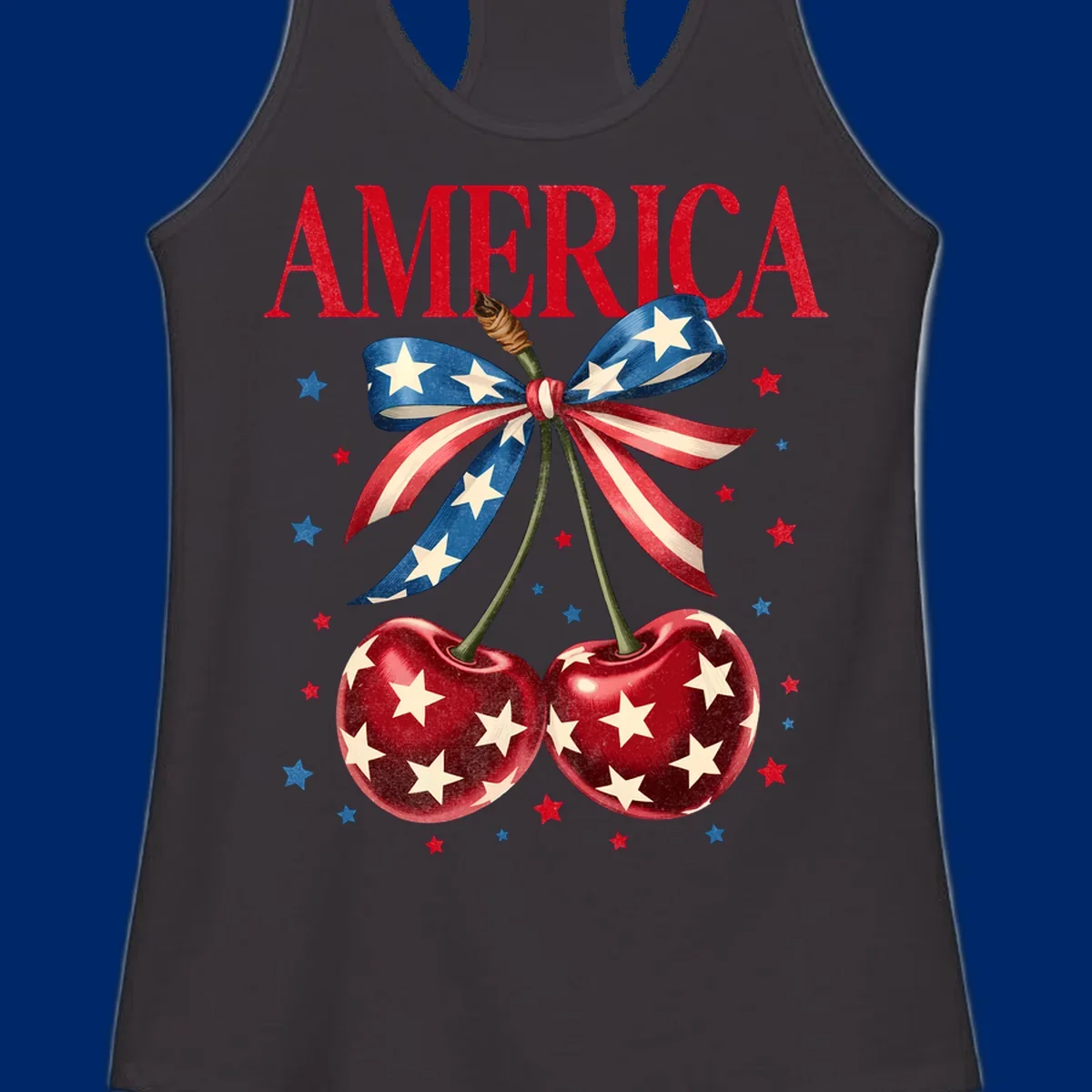 Vintage patriotic artwork featuring red 'AMERICA' text, two red cherries with white stars, and an American flag ribbon. Scattered red and blue stars complete this America-cherries-stars design.