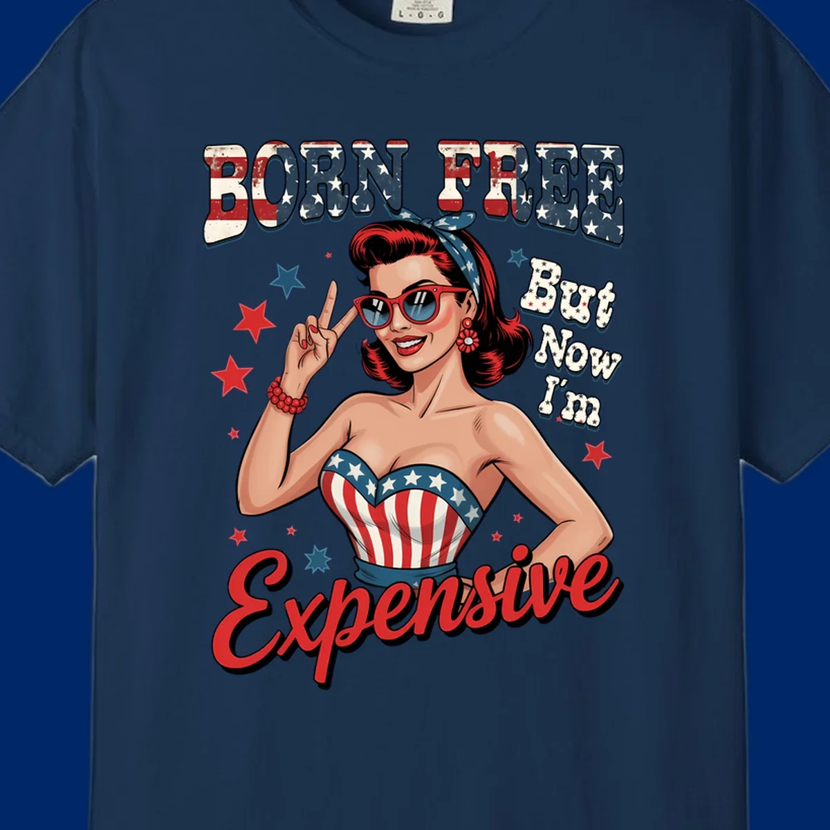 Retro pin-up girl making a peace sign, wearing a stars and stripes top, with the text 'BORN FREE But Now I'm Expensive'. This born-free-expensive-pin-up design is patriotic and fun.