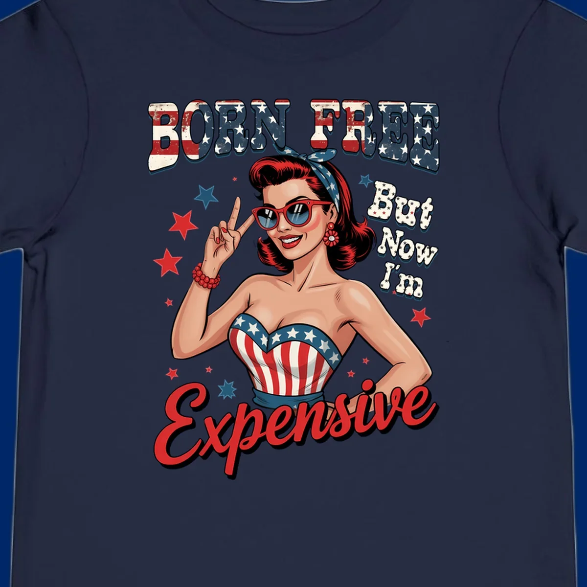 Retro pin-up girl making a peace sign, wearing a stars and stripes top, with the text 'BORN FREE But Now I'm Expensive'. This born-free-expensive-pin-up design is patriotic and fun.