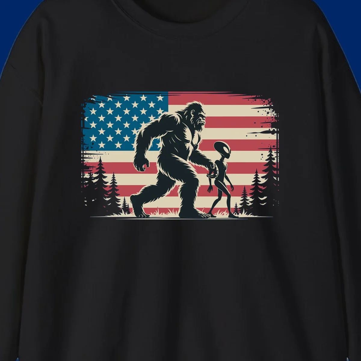 A vintage illustration of Bigfoot and a grey alien walking through a forest, set against a distressed bigfoot-alien-american-flag.