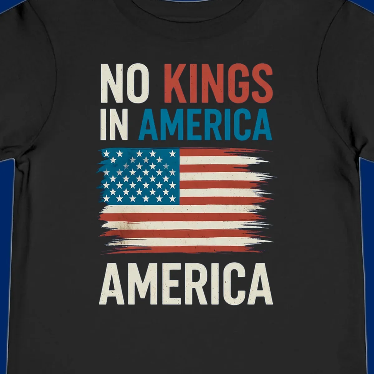 Distressed American flag design with the text 'NO KINGS IN AMERICA' above and 'AMERICA' below, representing the no-kings-in-america-flag concept.