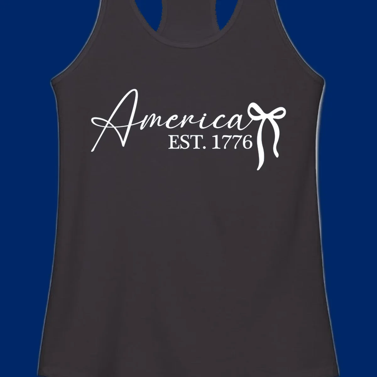 White script text "America" with decorative flourishes above "EST. 1776" in serif font, on a black background. Design for america-est-1776.