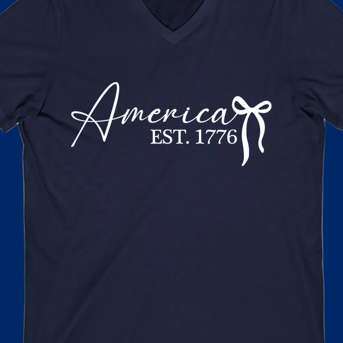 White script text "America" with decorative flourishes above "EST. 1776" in serif font, on a black background. Design for america-est-1776.