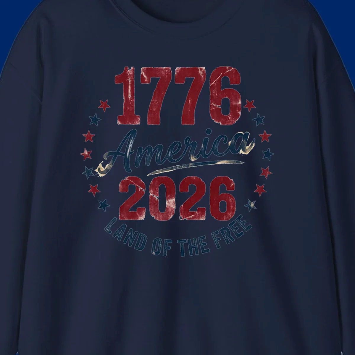Distressed circular design with '1776', 'America', '2026', and 'LAND OF THE FREE' text, encircled by stars, celebrating America's 250th anniversary.