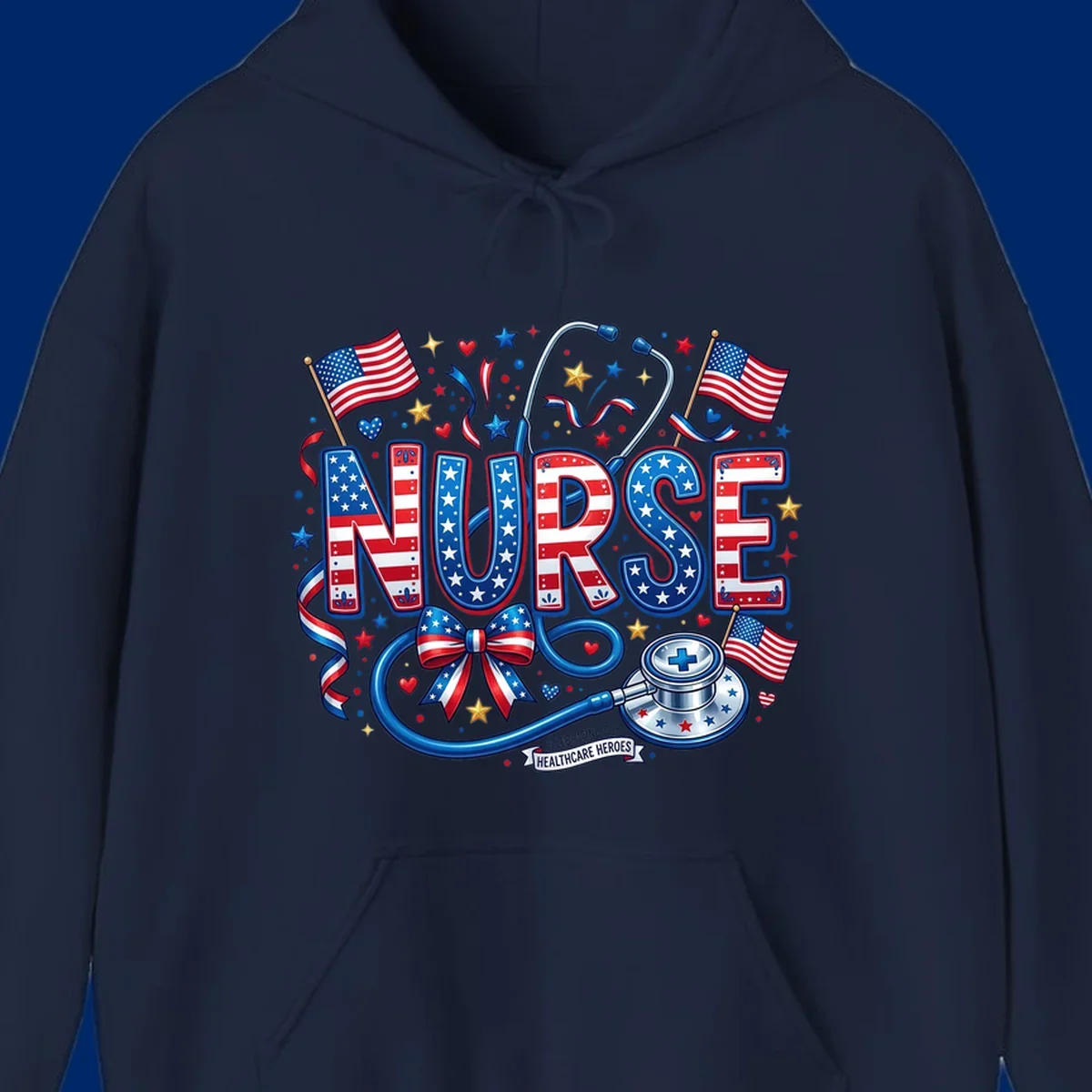 A vibrant patriotic nurse heroes design featuring the word NURSE in red, white, and blue, surrounded by American flags, a stethoscope, stars, and a banner saying 'CELEBRATING OUR HEALTHCARE HEROES'.