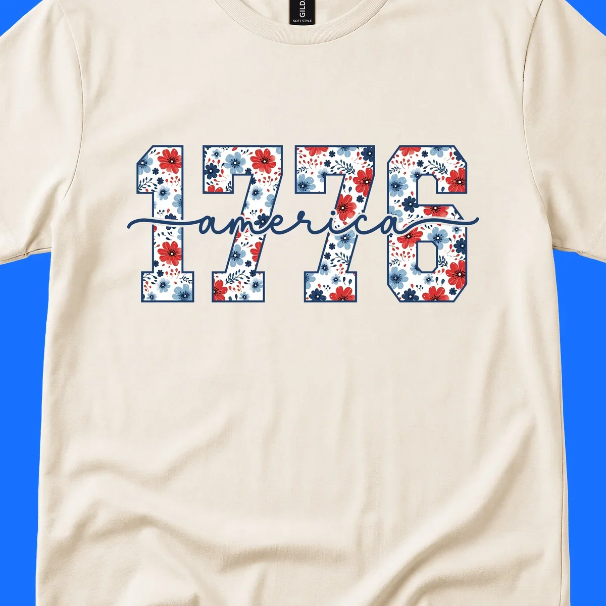 A design featuring the year 1776 with red and blue floral patterns inside each number, and the word 'america' in script below. The 1776-america-floral design is outlined in dark blue.