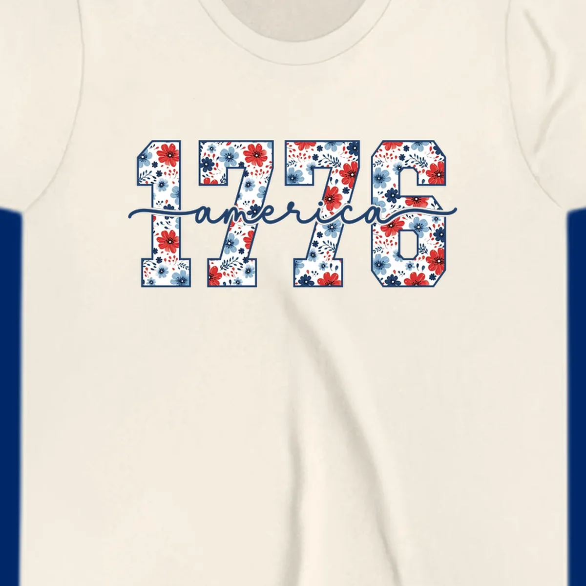 A design featuring the year 1776 with red and blue floral patterns inside each number, and the word 'america' in script below. The 1776-america-floral design is outlined in dark blue.