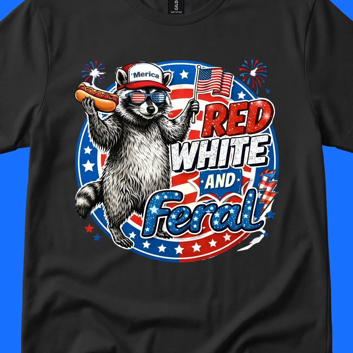 A patriotic-raccoon-feral illustration of a raccoon in a 'Merica hat, flag sunglasses, holding a hotdog and US flag. Text: RED WHITE AND Feral.