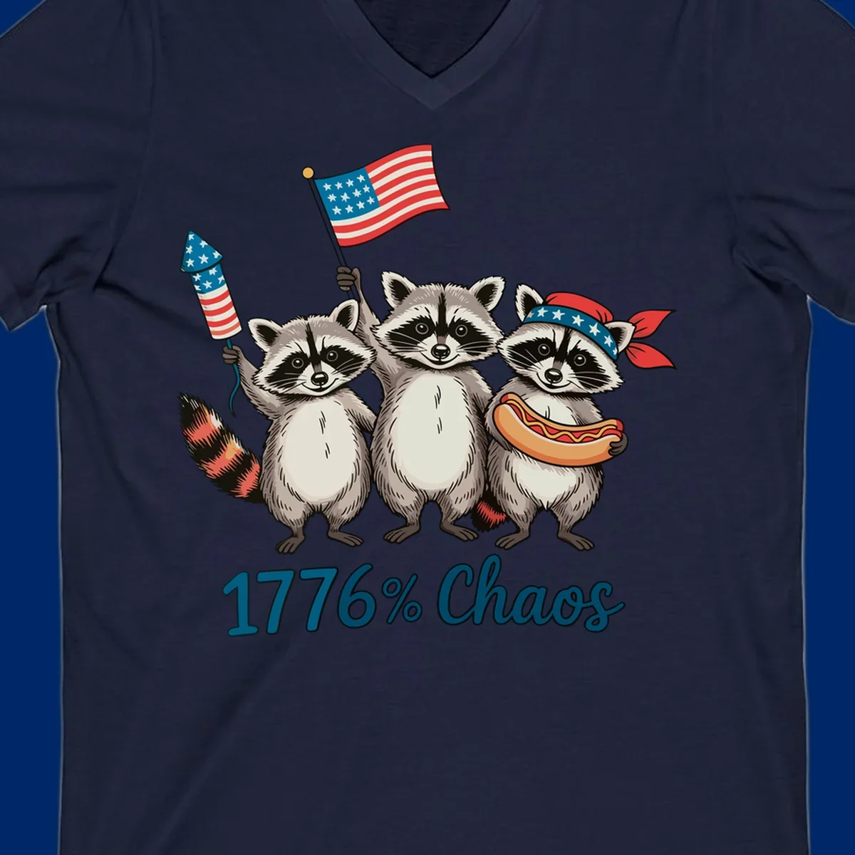 Illustration of three patriotic raccoons celebrating with an American flag, firework, and hot dog, with '1776% Chaos' text. Represents 1776-chaos-raccoons-celebration.