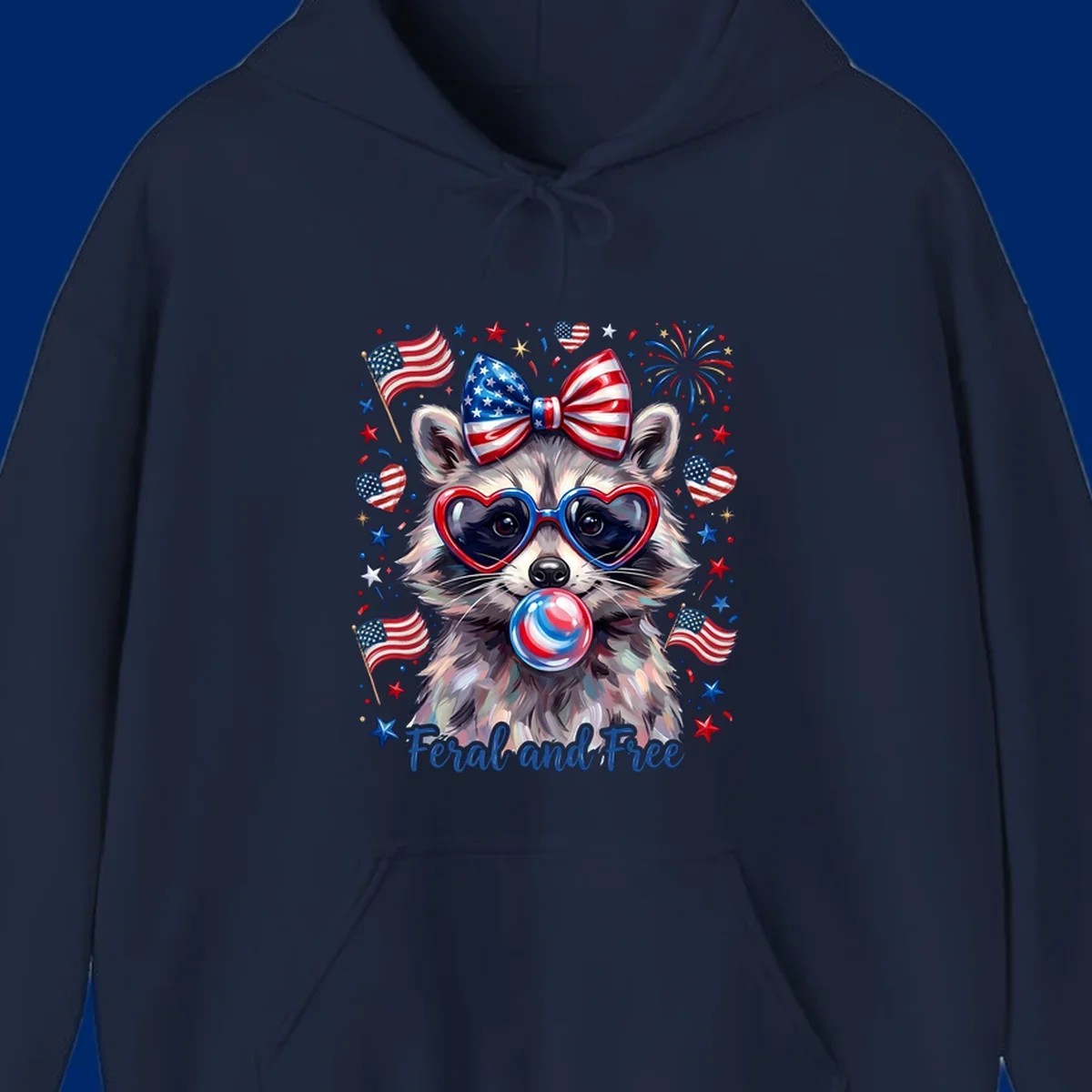Watercolor illustration of a patriotic raccoon wearing heart sunglasses, blowing bubblegum, with American flags, fireworks, and 'Feral and Free' text for a patriotic-raccoon-july-4th celebration.