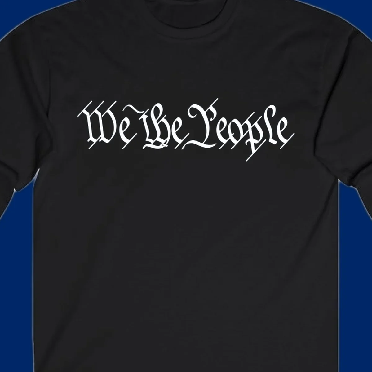 The phrase 'WE THE PEOPLE' is written in a decorative white calligraphic font, representing the we-the-people-heritage.