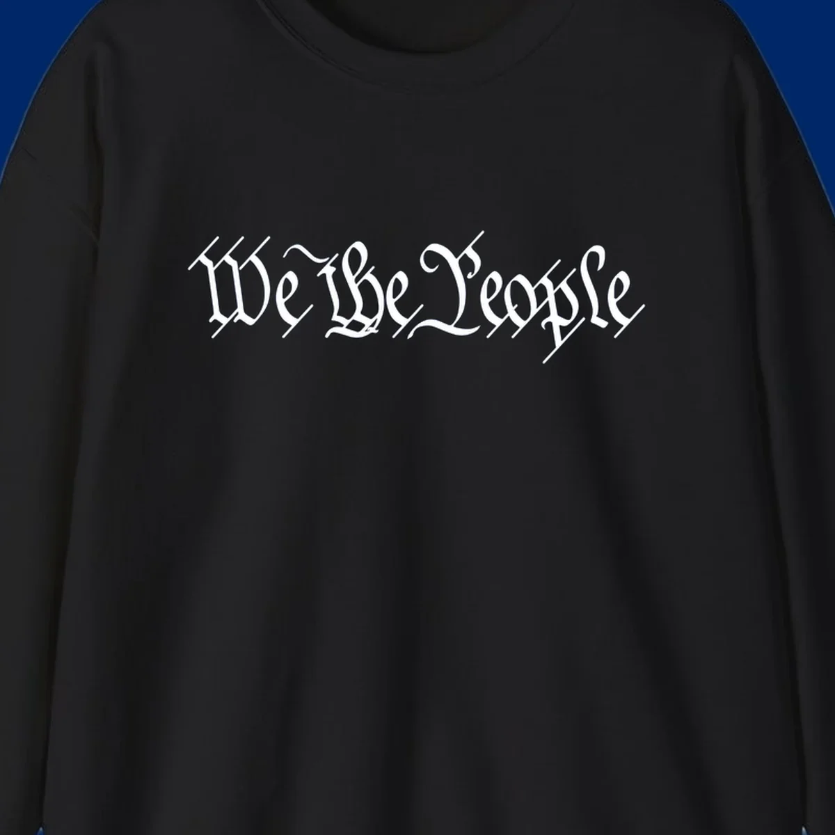 The phrase 'WE THE PEOPLE' is written in a decorative white calligraphic font, representing the we-the-people-heritage.