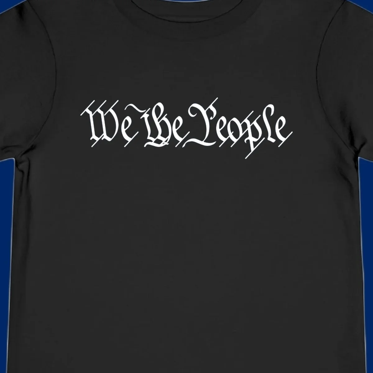 The phrase 'WE THE PEOPLE' is written in a decorative white calligraphic font, representing the we-the-people-heritage.