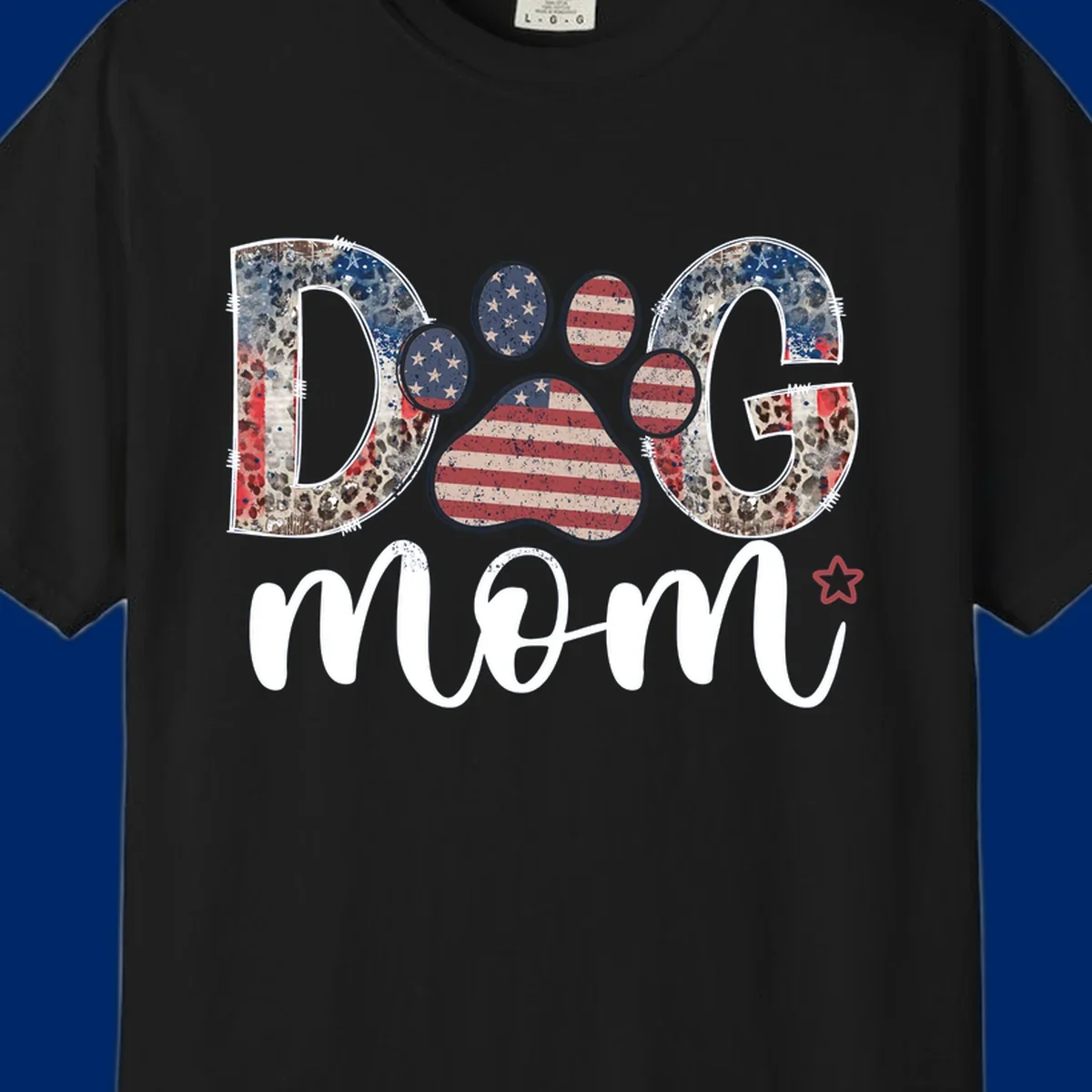 A graphic spelling 'DOG' with a patriotic-dog-paw-print. The 'D' and 'G' have leopard print and flag elements, and the 'O' is a flag paw print.