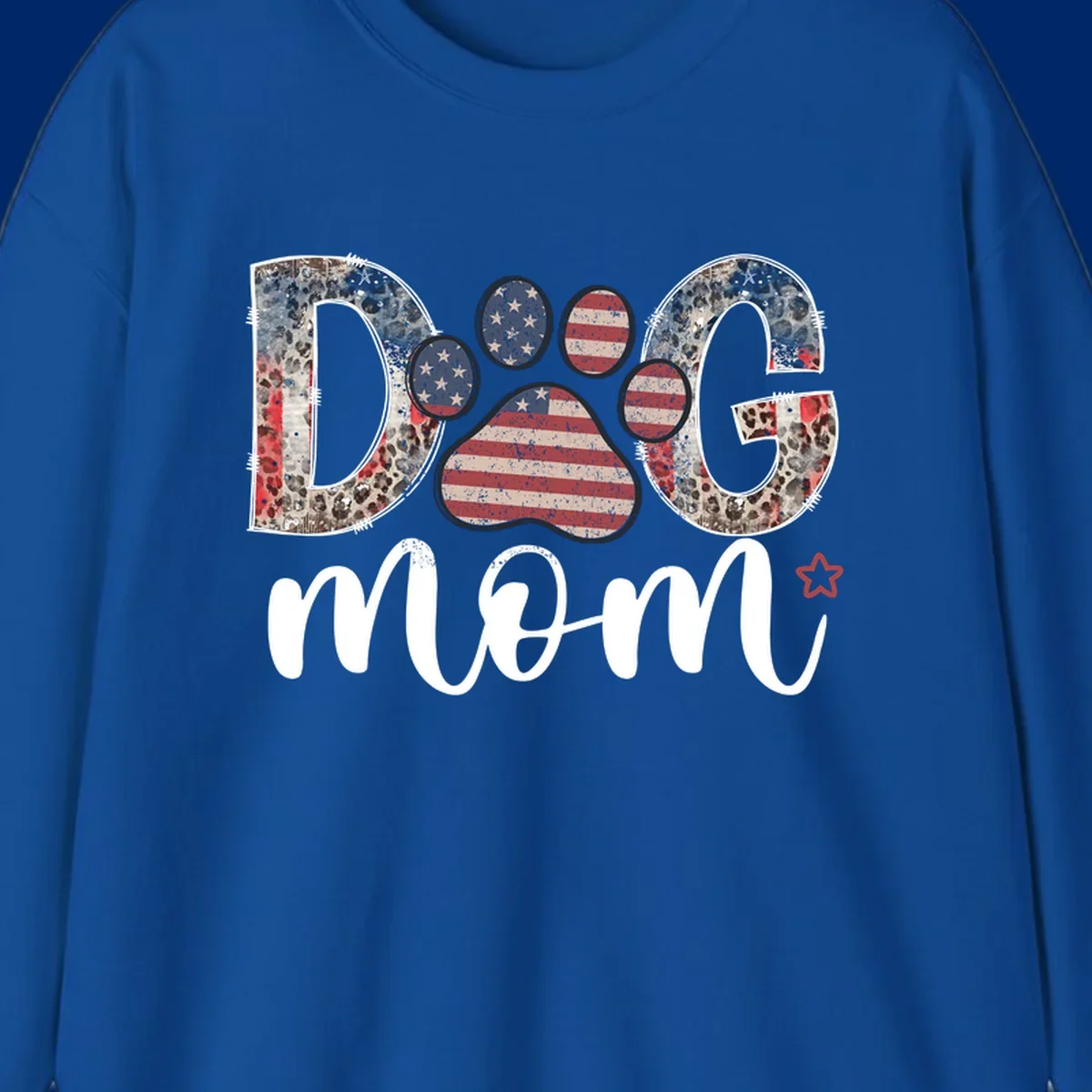 A graphic spelling 'DOG' with a patriotic-dog-paw-print. The 'D' and 'G' have leopard print and flag elements, and the 'O' is a flag paw print.