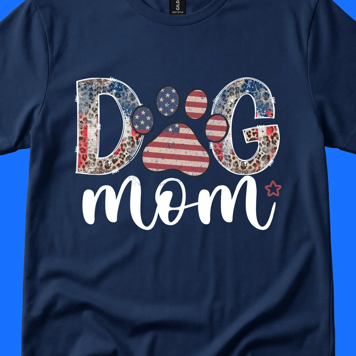 A graphic spelling 'DOG' with a patriotic-dog-paw-print. The 'D' and 'G' have leopard print and flag elements, and the 'O' is a flag paw print.